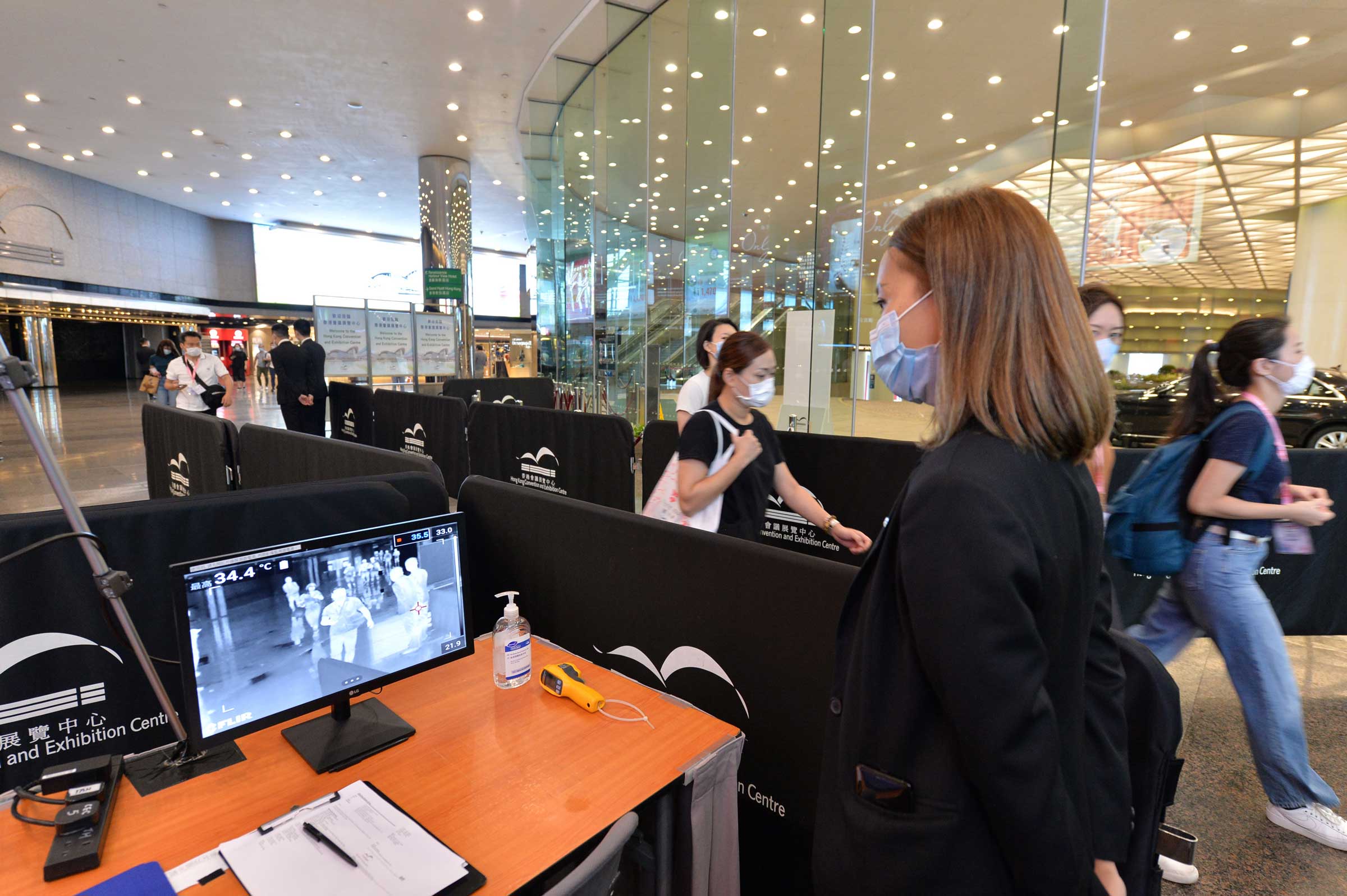 Temperature check for all visitors entering the HKCEC is conducted at control points